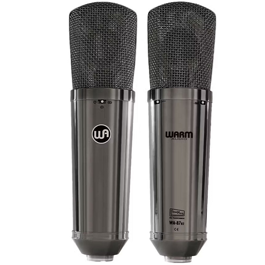 Pair of Warm Audio WA-87 R2 TS stereo condenser microphones with black metal bodies and vintage-style grille for professional audio recording.