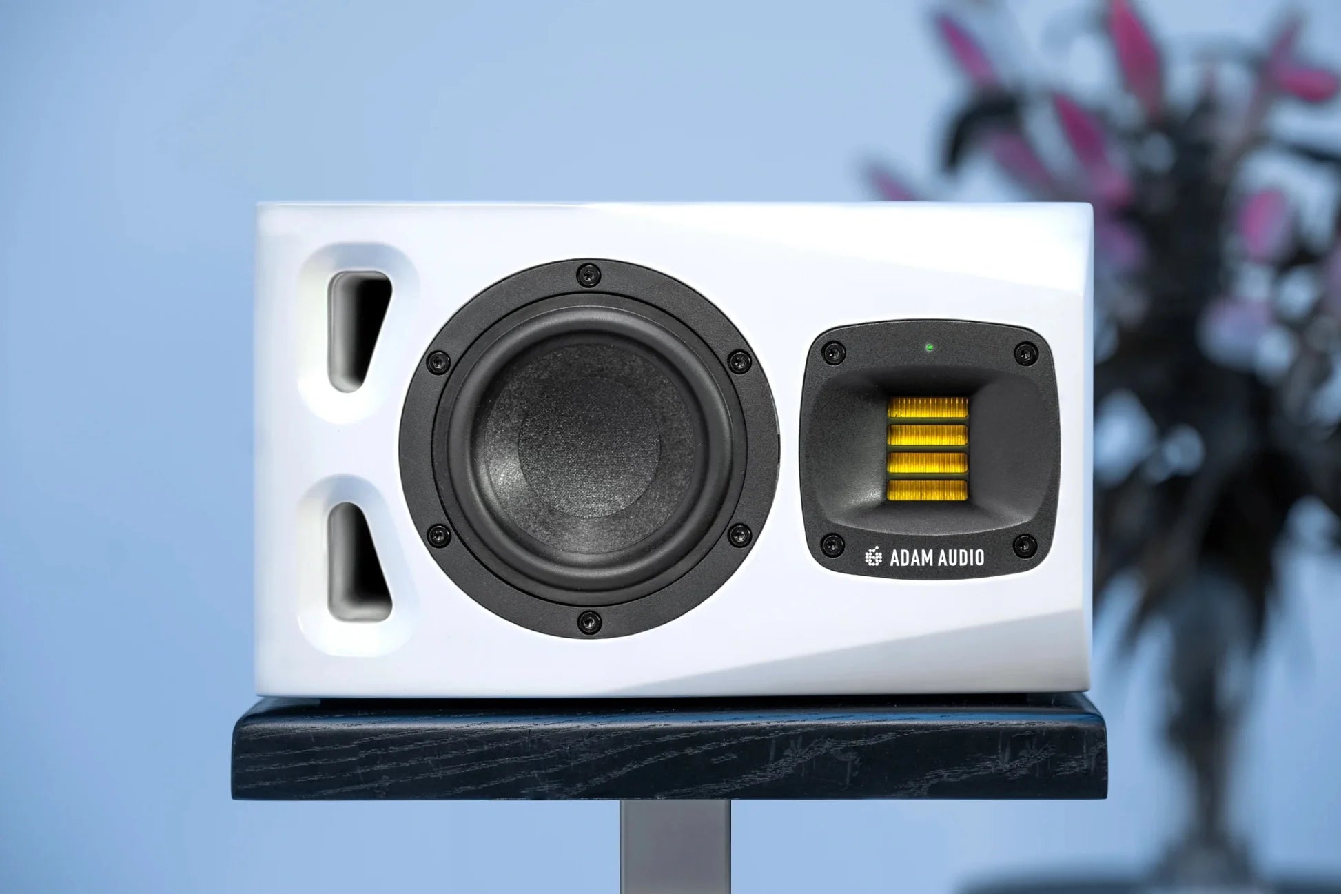 Adam Audio A4V active nearfield studio monitors, 25th anniversary limited edition, shown in a professional studio setup.