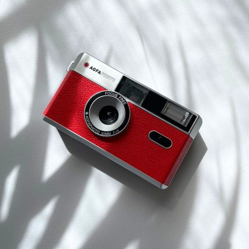 AgfaPhoto reusable analogue camera from the instant and compact camera collection, featuring a sleek design and manual controls.