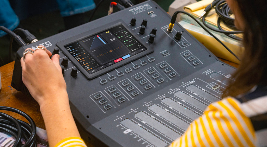 Alto Professional TMD16 digital mixer with multiple input channels and control knobs, ideal for live sound and recording setups.