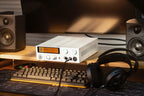 FiiO K15 desktop headphone amplifier and DAC with digital display, black finish, and multiple input options.