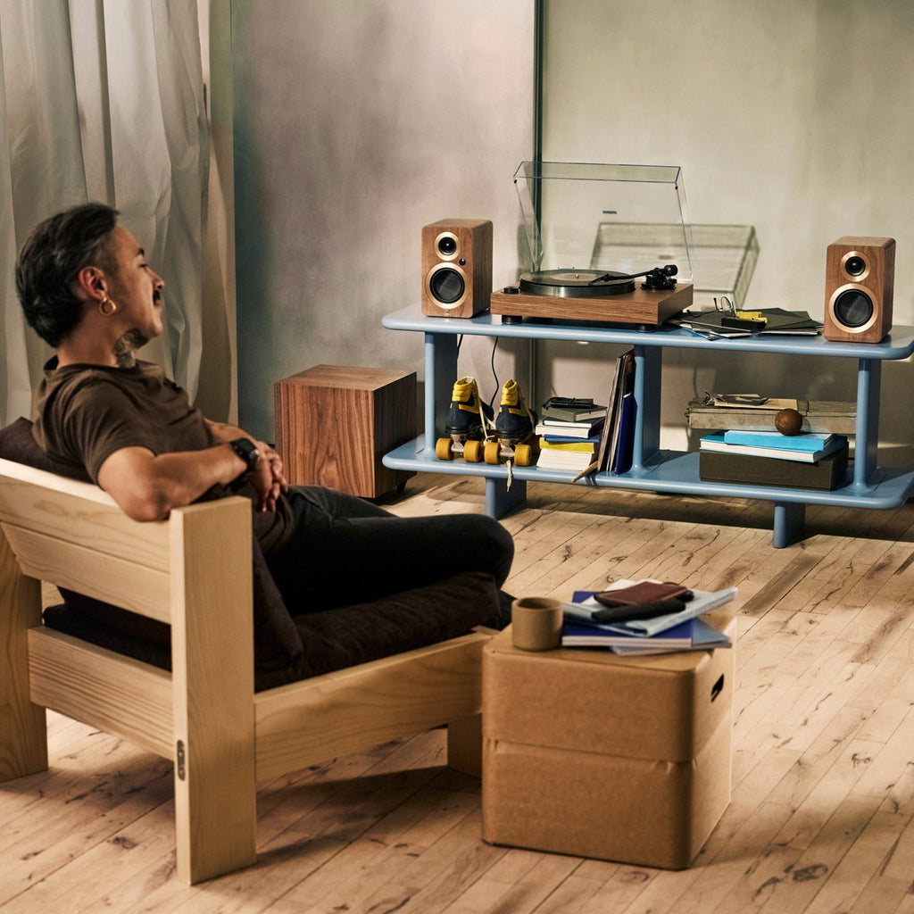 Argon Audio AURORA turntable in walnut with Argon speakers in a living room
