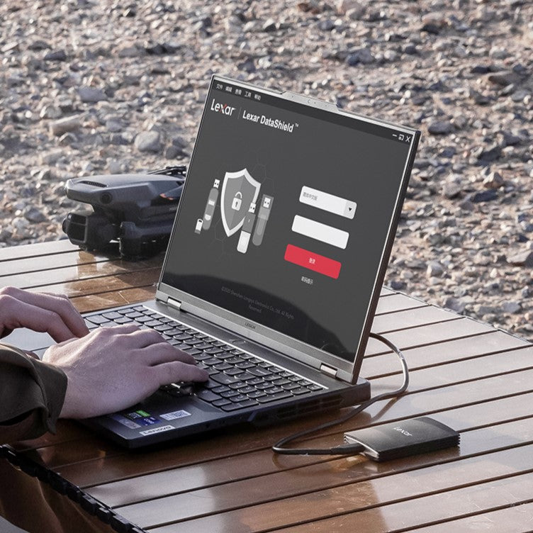 Lexar Armor 700 portable SSD external drive with rugged design and USB-C port, shown with protective casing and sleek black finish.
