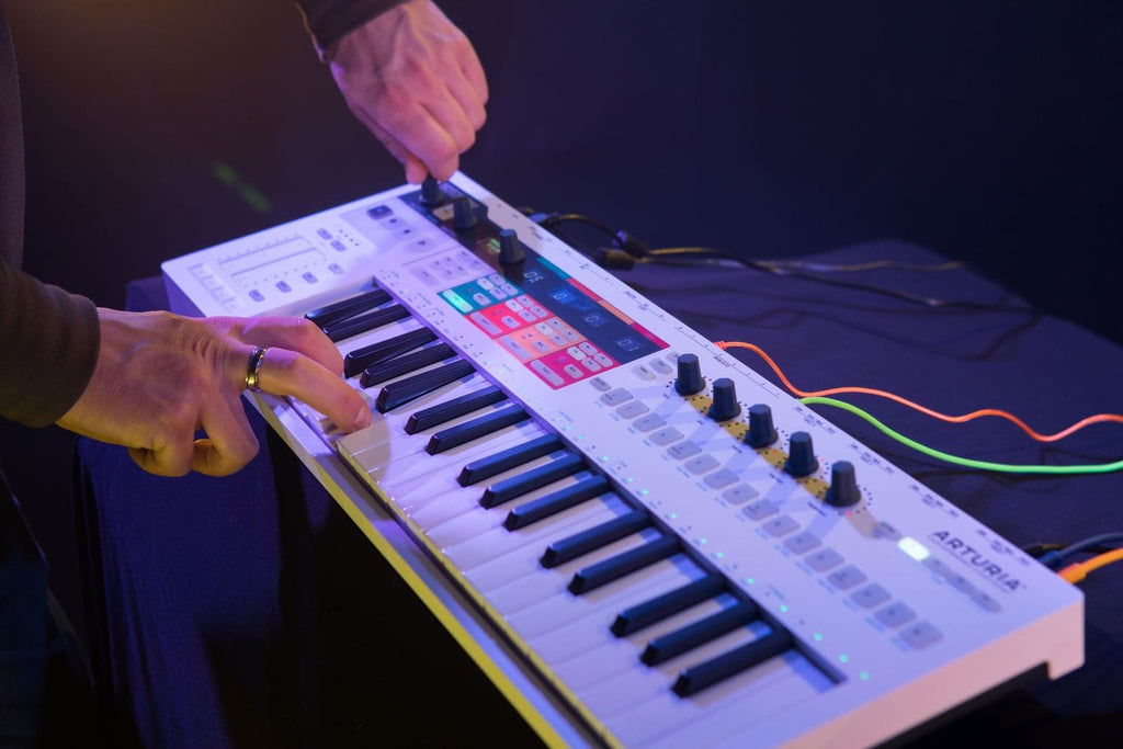 Arturia Keystep Pro sequencer with keyboard and control knobs, showcasing its integrated interface and compact design.