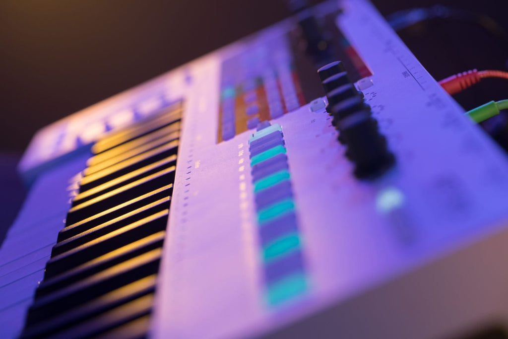 Arturia Keystep Pro sequencer with MIDI and CV connectivity, featuring a compact keyboard and control interface.