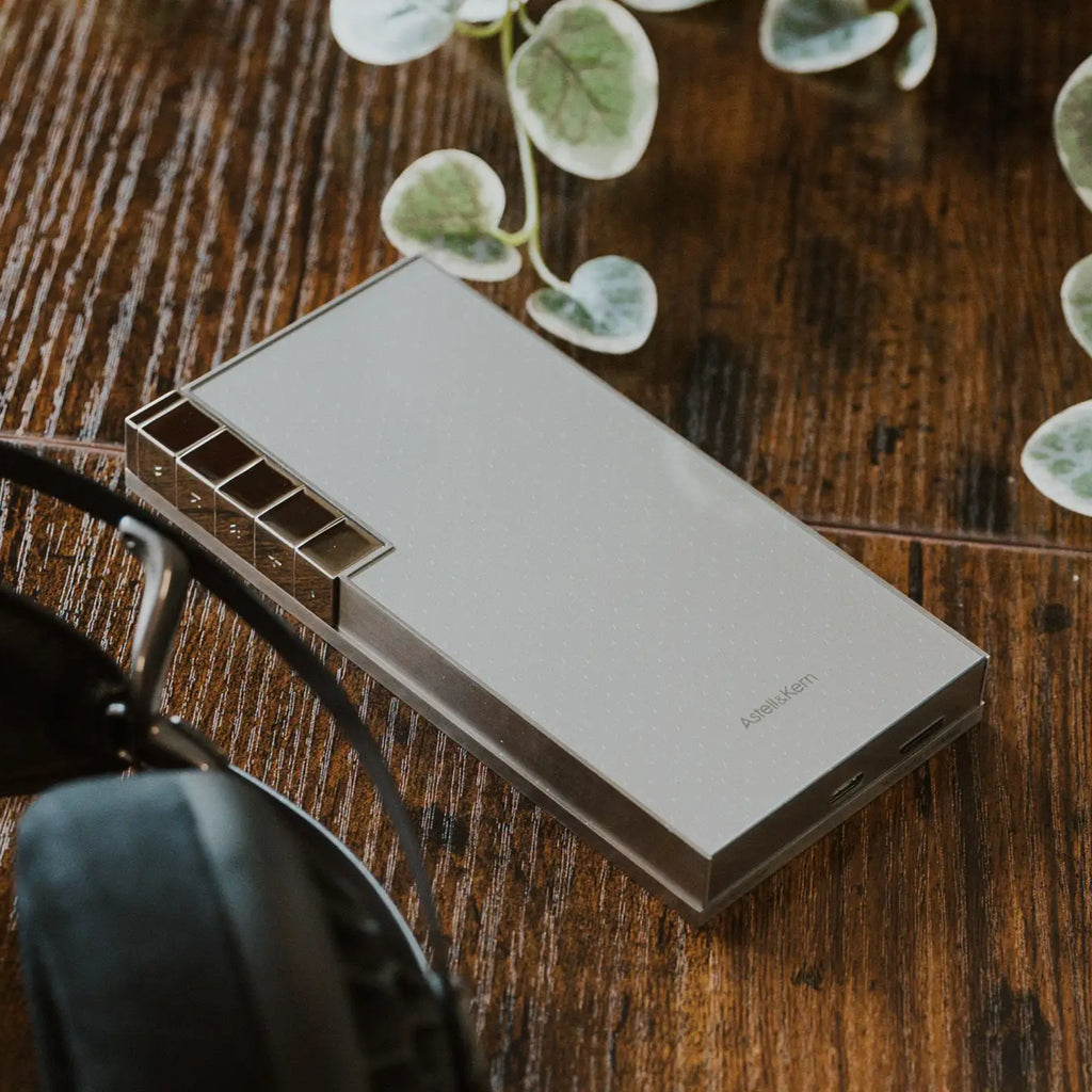 Astell&Kern PD10 portable music player in a lifestyle setting, showing its sleek design and compact size for high-quality audio.