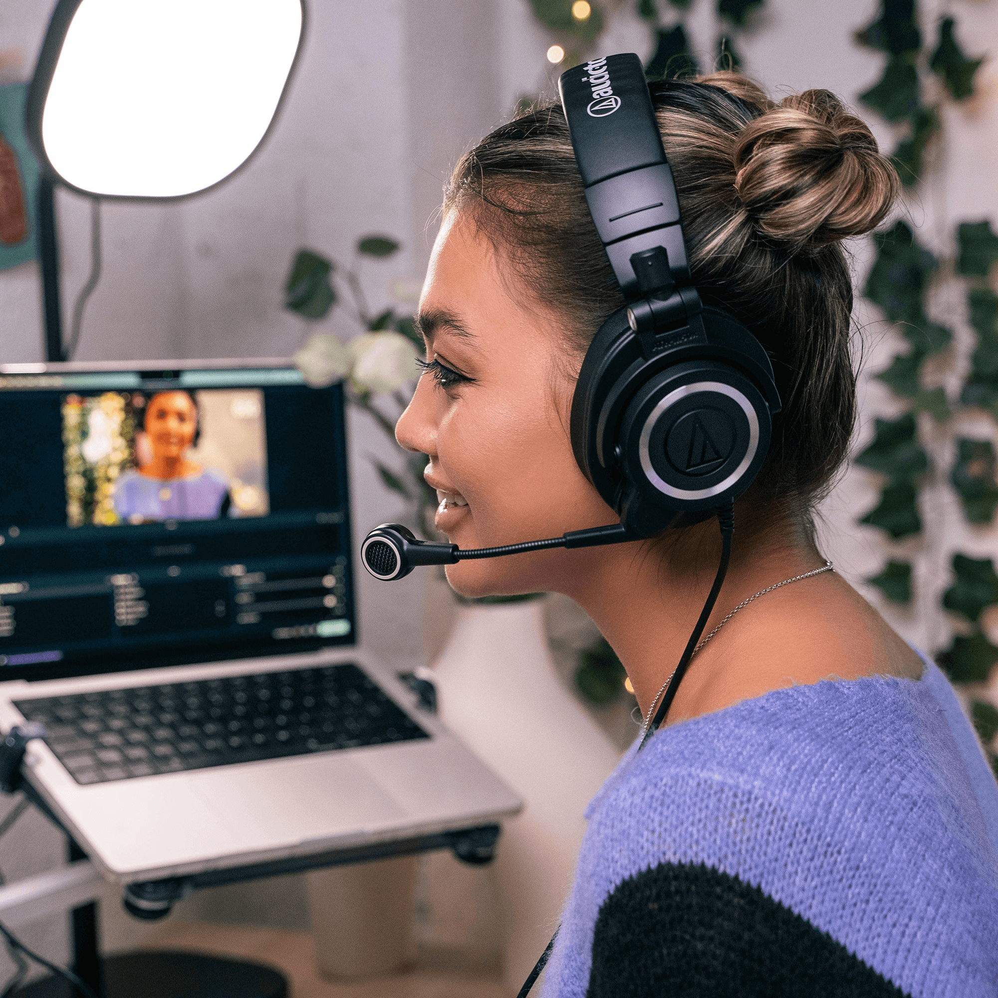 Audio Technica ATH-M50xSTS gaming headphones with USB connection, featuring over-ear design and adjustable headband.