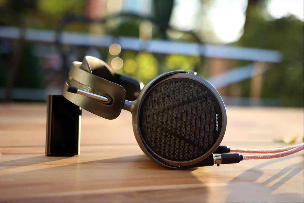 Audeze MM-500 studio headphones with large ear cups and headband, designed for high-fidelity music production and audiophile listening.