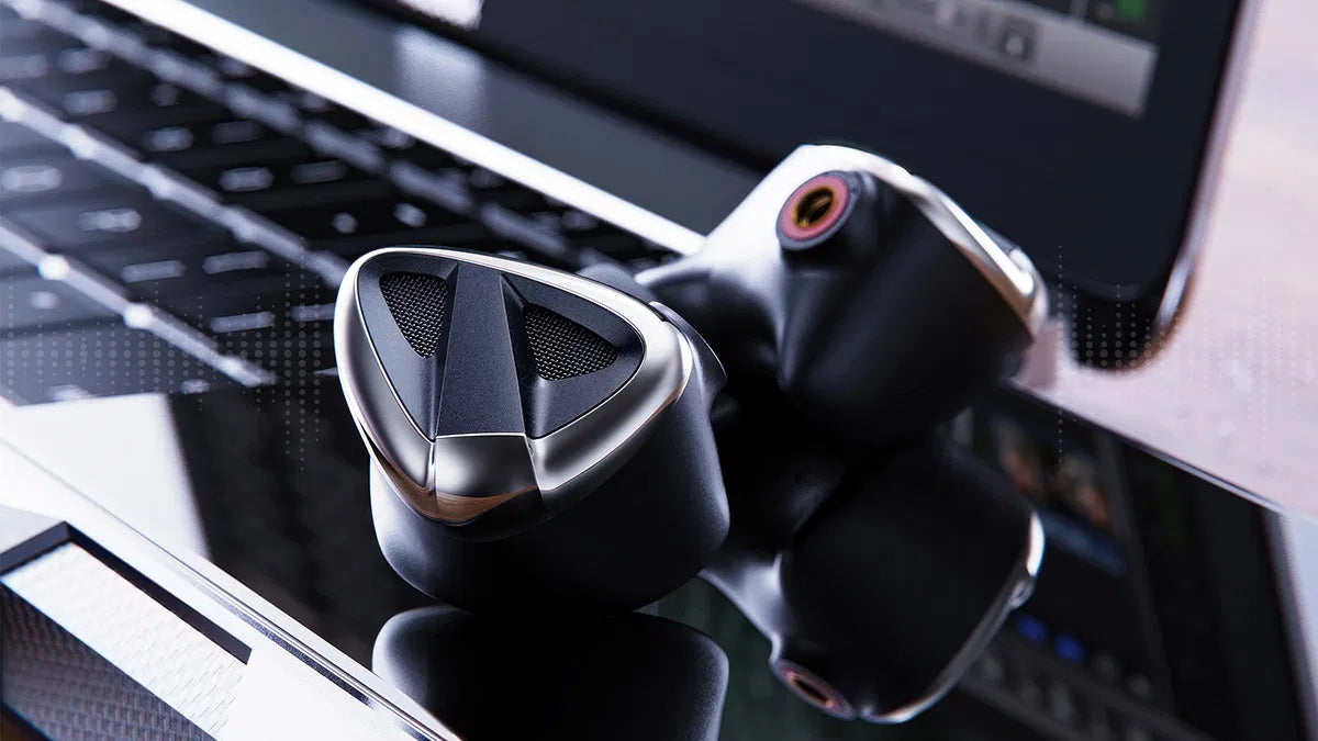 FiiO FH19 in-ear headphones with black ear tips and sleek design, shown from front view with cable attachment visible.