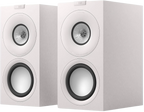 KEF Q Concerto Meta passive bookshelf speakers shown in a stylish home setup, highlighting their sleek design and compact size.