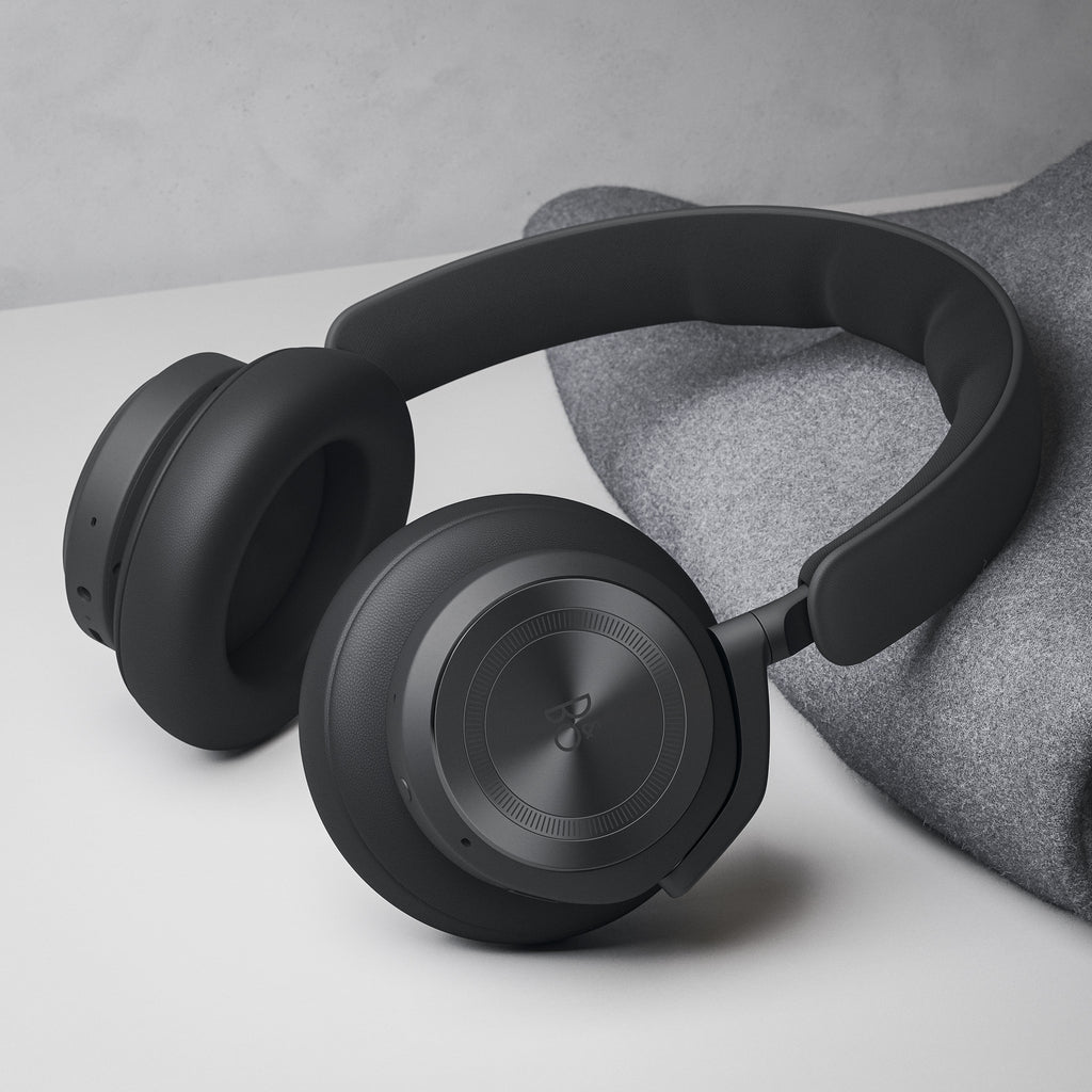 Wireless Bang & Olufsen Beoplay HX headphones in anthracite, shown in a lifestyle setting with sleek, modern design.
