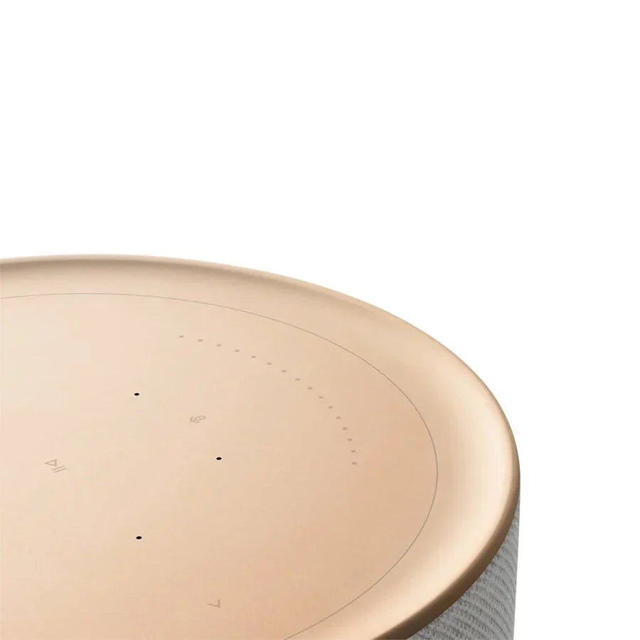 Bang & Olufsen Beosound Balance wireless speaker with white marble finish, showcasing sleek, modern design and premium craftsmanship.