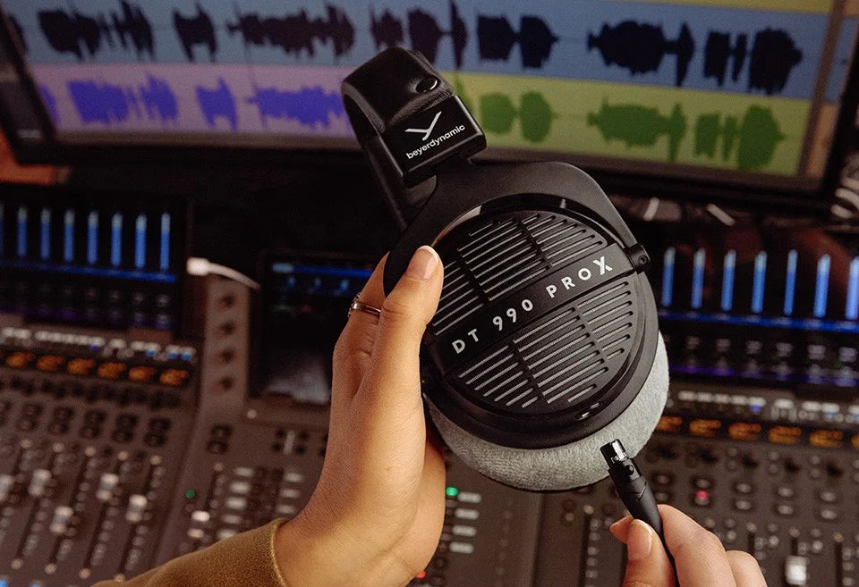 Beyerdynamic DT 990 Pro X studio headphones, in silver, coiled