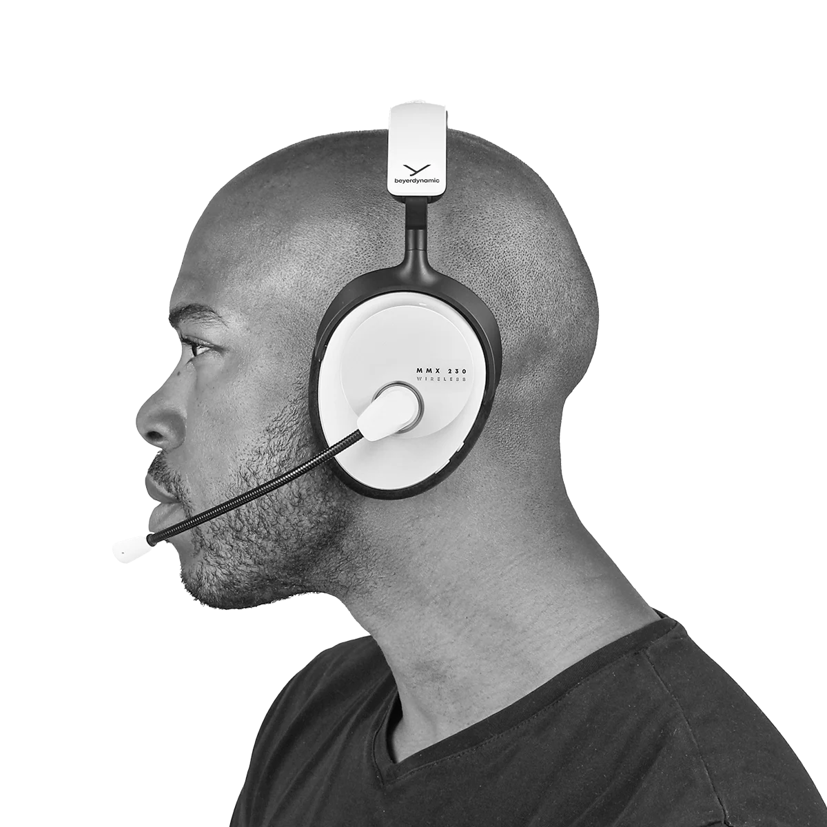 Beyerdynamic MMX 230 Wireless gaming headphones in white with over-ear design and built-in microphone, worn by a person.