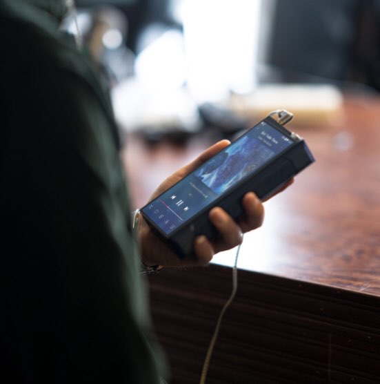FiiO M17 portable music player with sleek black design and touchscreen display, showcasing high-resolution audio interface.