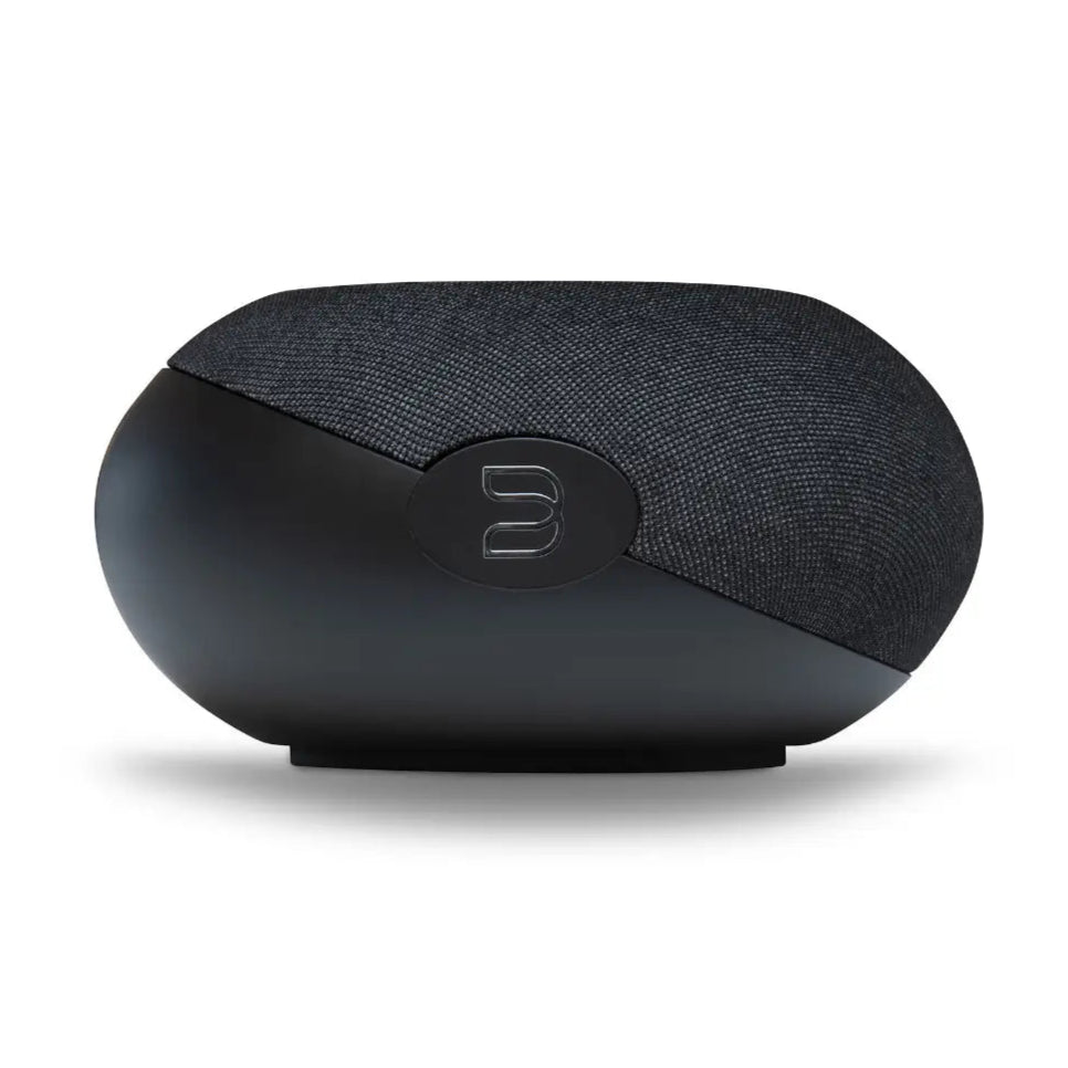 Bluesound Pulse Cinema Mini soundbar in black, right side view on tabletop showing sleek design and speaker grille.