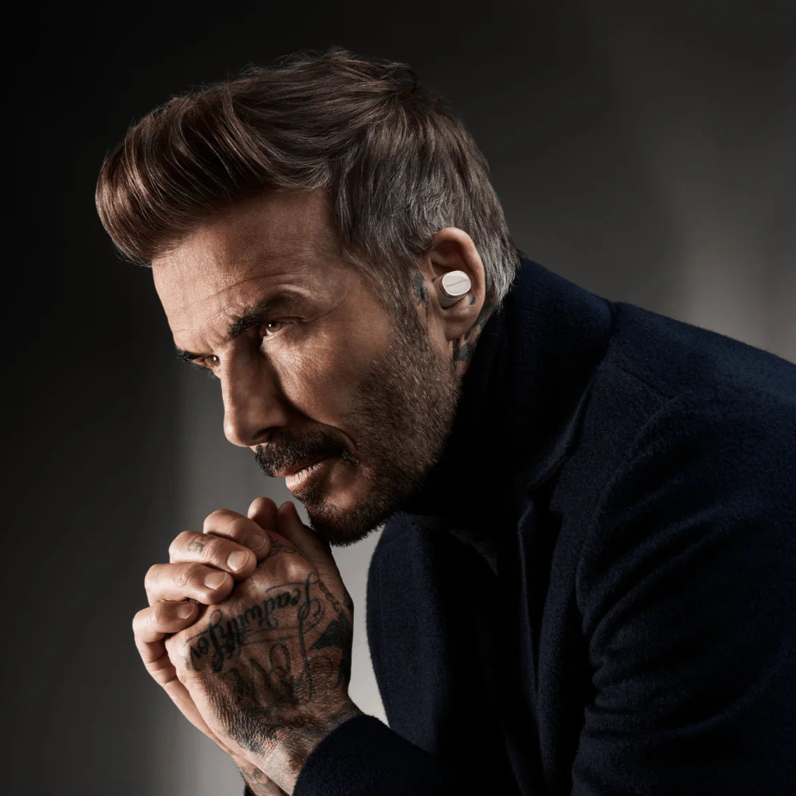 Bowers & Wilkins Pi8 wireless in-ear headphones with sleek black earbuds and integrated controls visible in the image.