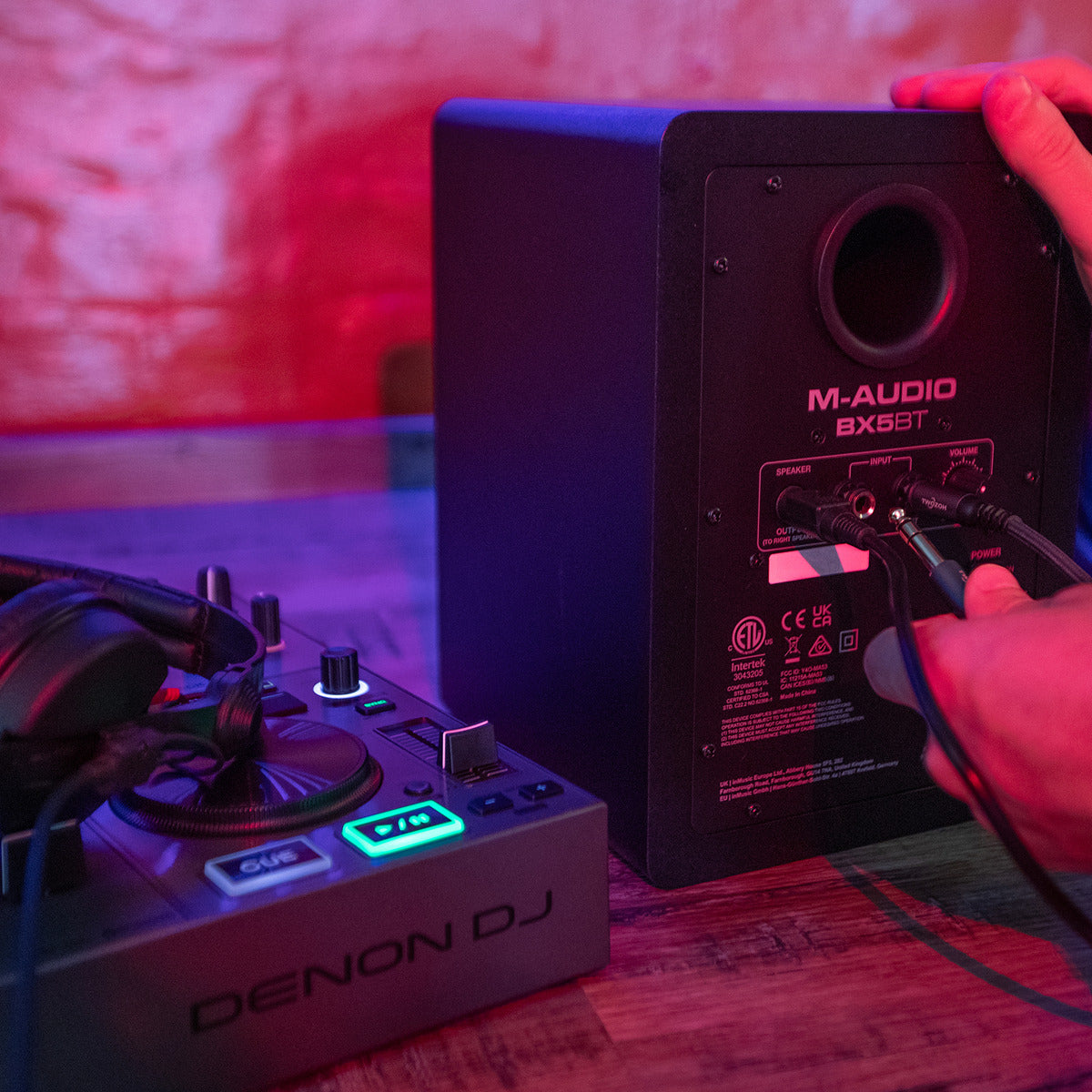 M-Audio BX5 BT active nearfield monitors with rear connections and Bluetooth functionality, shown from the back.