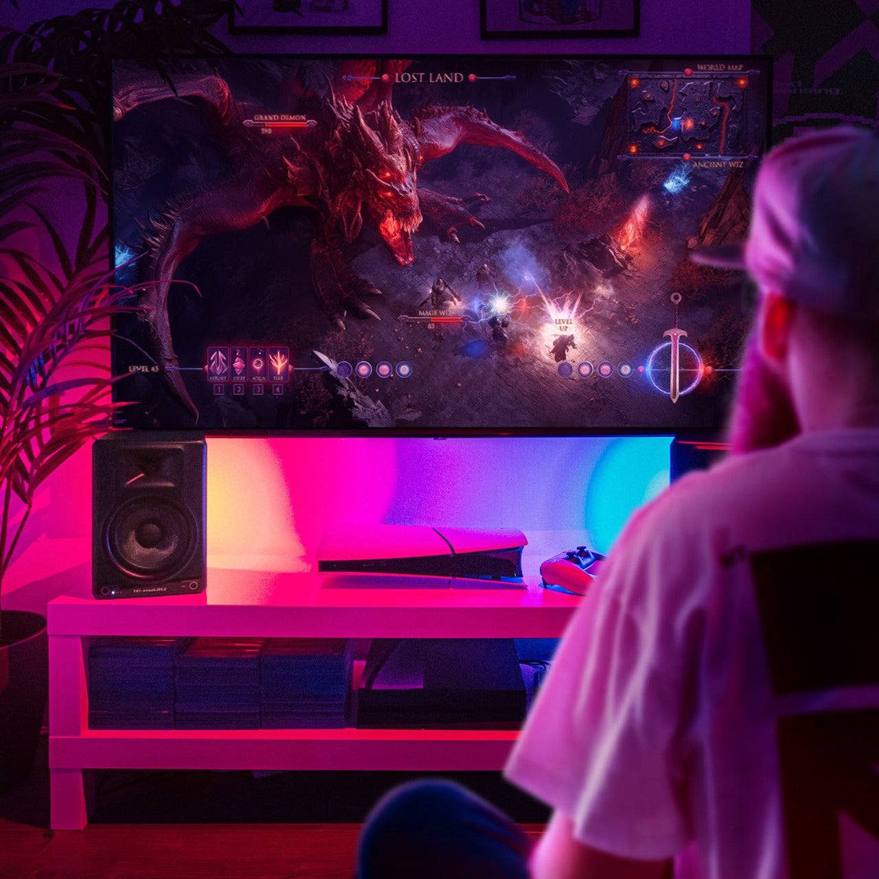 M-Audio BX5 BT active nearfield monitors set up for gaming and mobile use, showcasing sleek black design and front-facing speakers.