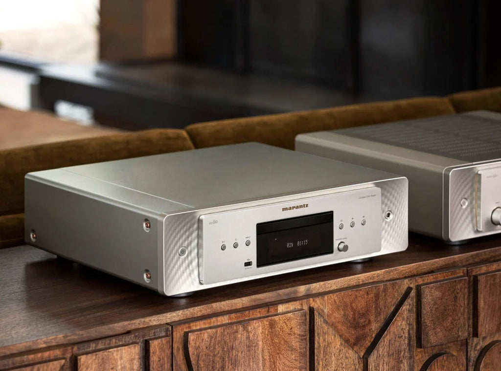 Marantz CD 60 CD player with sleek design and silver finish, featuring a disc tray, control buttons, and display panel.