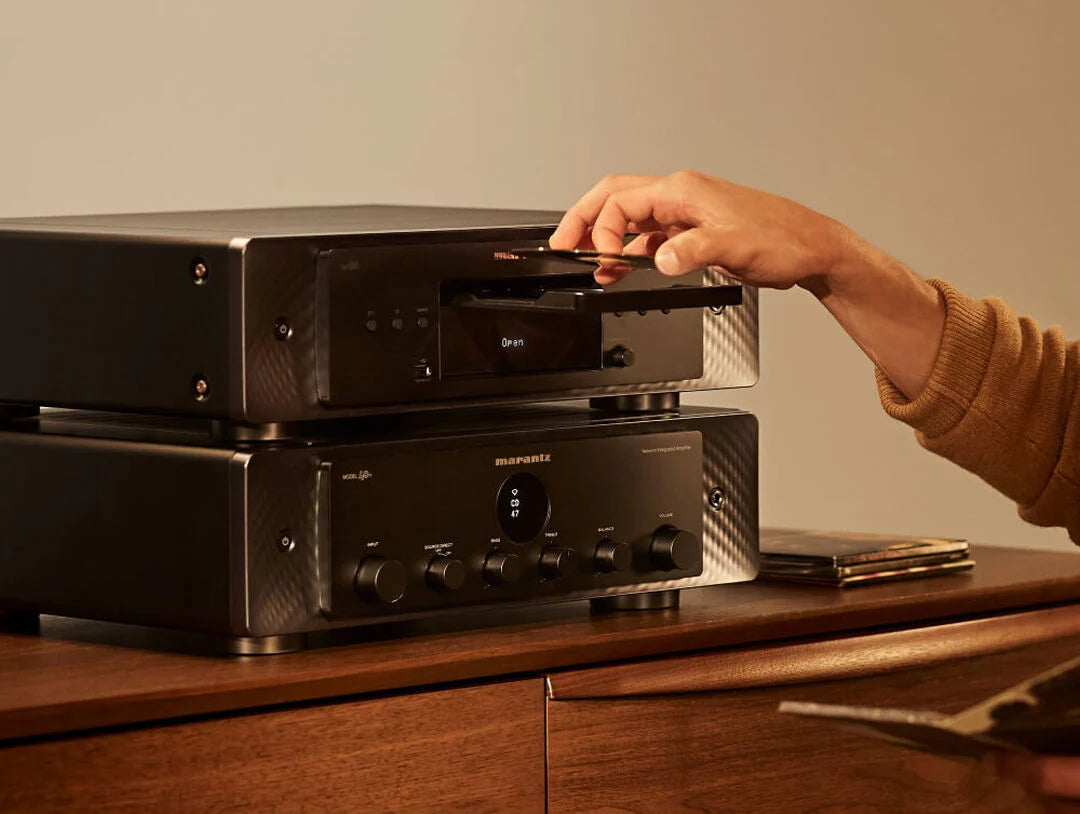 Marantz CD 60 CD player with sleek design and silver finish, featuring front-loading disc tray and control buttons.