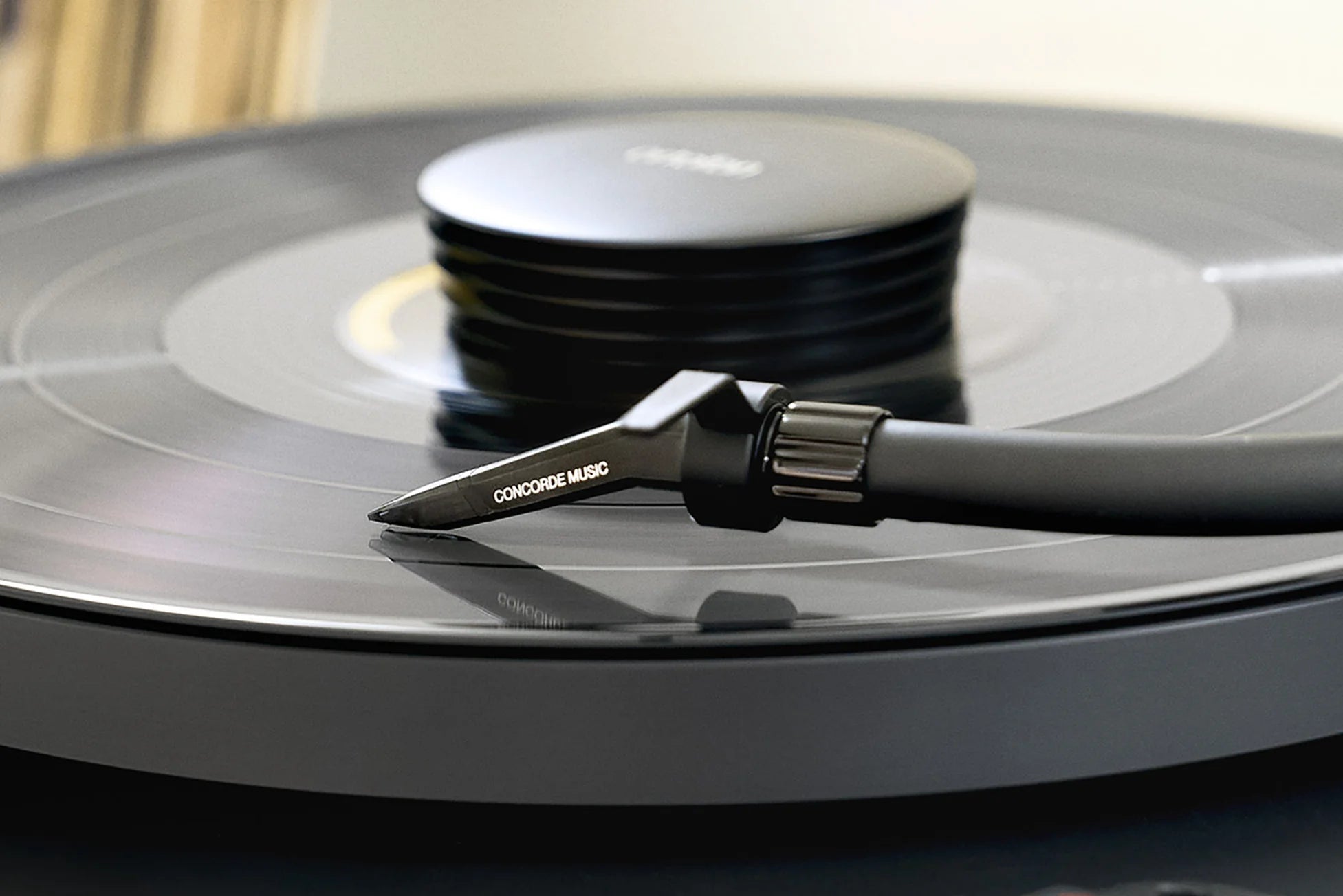 Close-up of Ortofon Concorde Music Black turntable cartridge mounted on a Pro-Ject turntable.