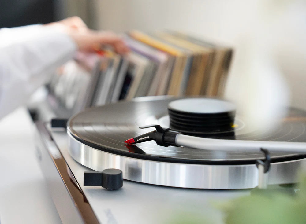 Ortofon Concorde Music Red turntable cartridge installed on Thorens turntable, close-up view of stylus and cartridge body.