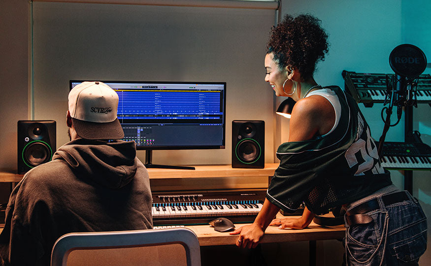 Mackie CR4.5 desktop speakers with black enclosures and control knobs on the front panel, designed for audio monitoring.