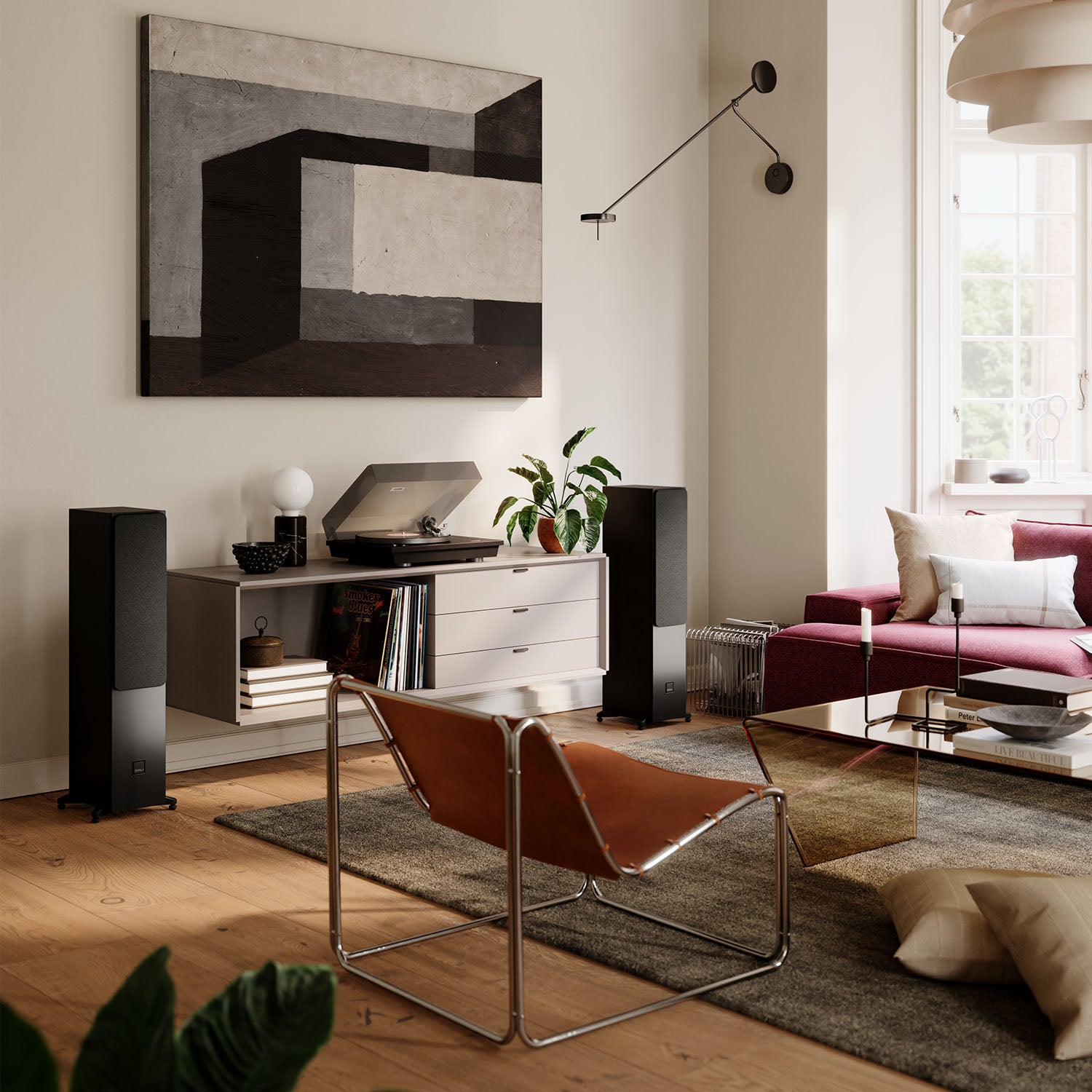 DALI Sonik 5 passive floorstanding speakers with sleek black cabinets and multiple drivers for high-quality sound.
