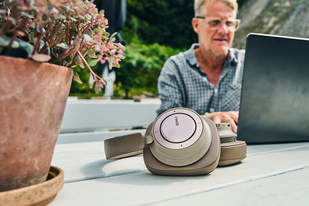 DALI Dali iO-12 wireless Bluetooth headphones in mocha grey with over-ear design and soft ear cushions.