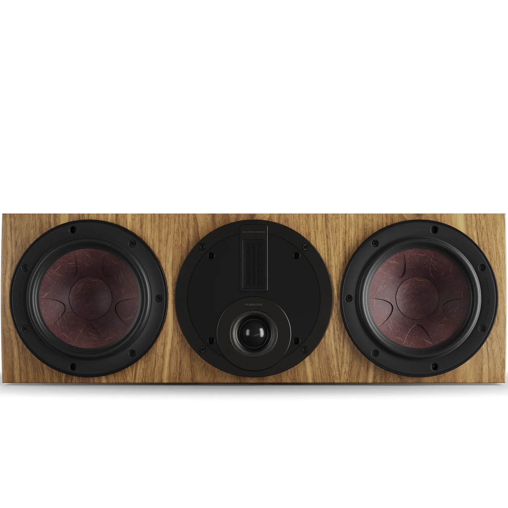 DALI Rubikore Cinema center speaker in natural walnut finish, showcasing the sleek design and wood grain details.