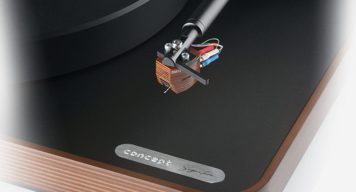 Clearaudio Concept Signature manual turntable with dark wood finish and sleek design, showcasing high-quality audio equipment.