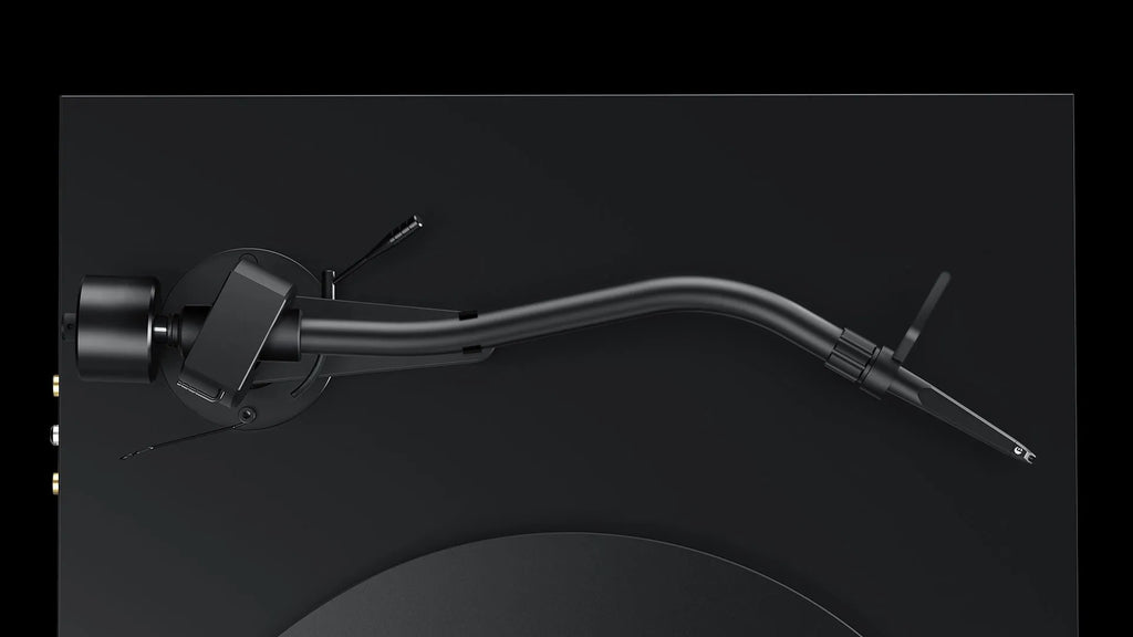 Pro-Ject Debut Pro S turntable with curved tonearm in satin black, viewed from top showing the platter and tonearm layout.