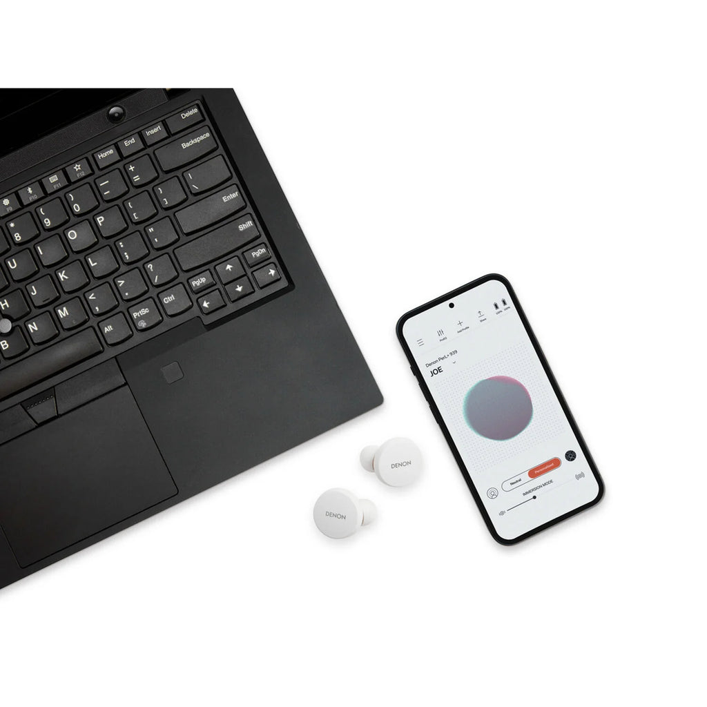 Denon PerL wireless in-ear headphones, lifestyle with companion app on laptop and phone