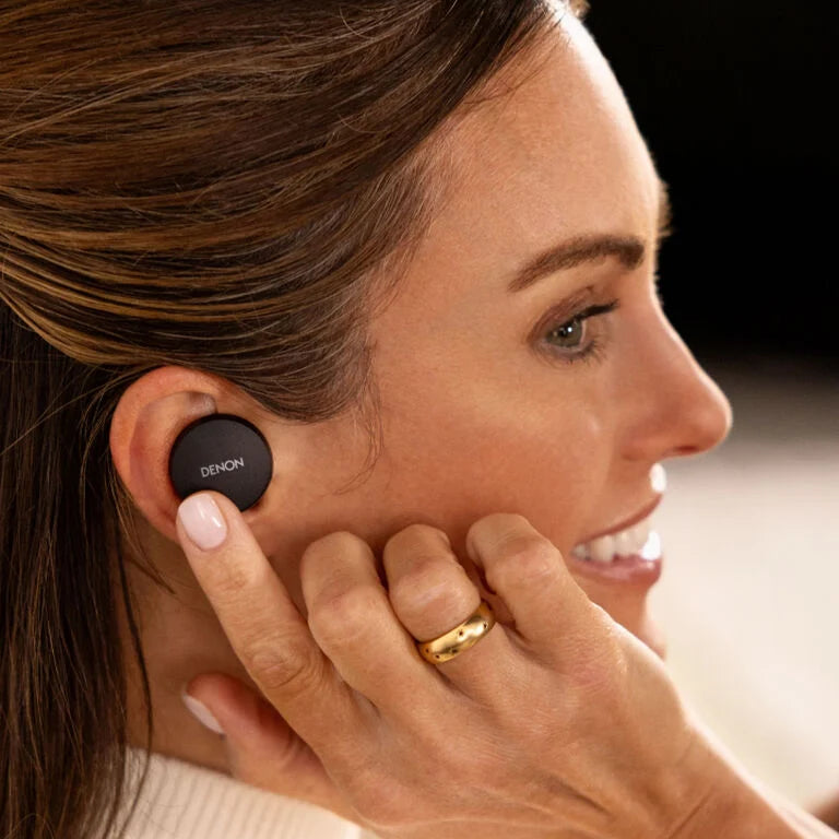 Denon PerL wireless in-ear headphones, lifestyle, worn in black