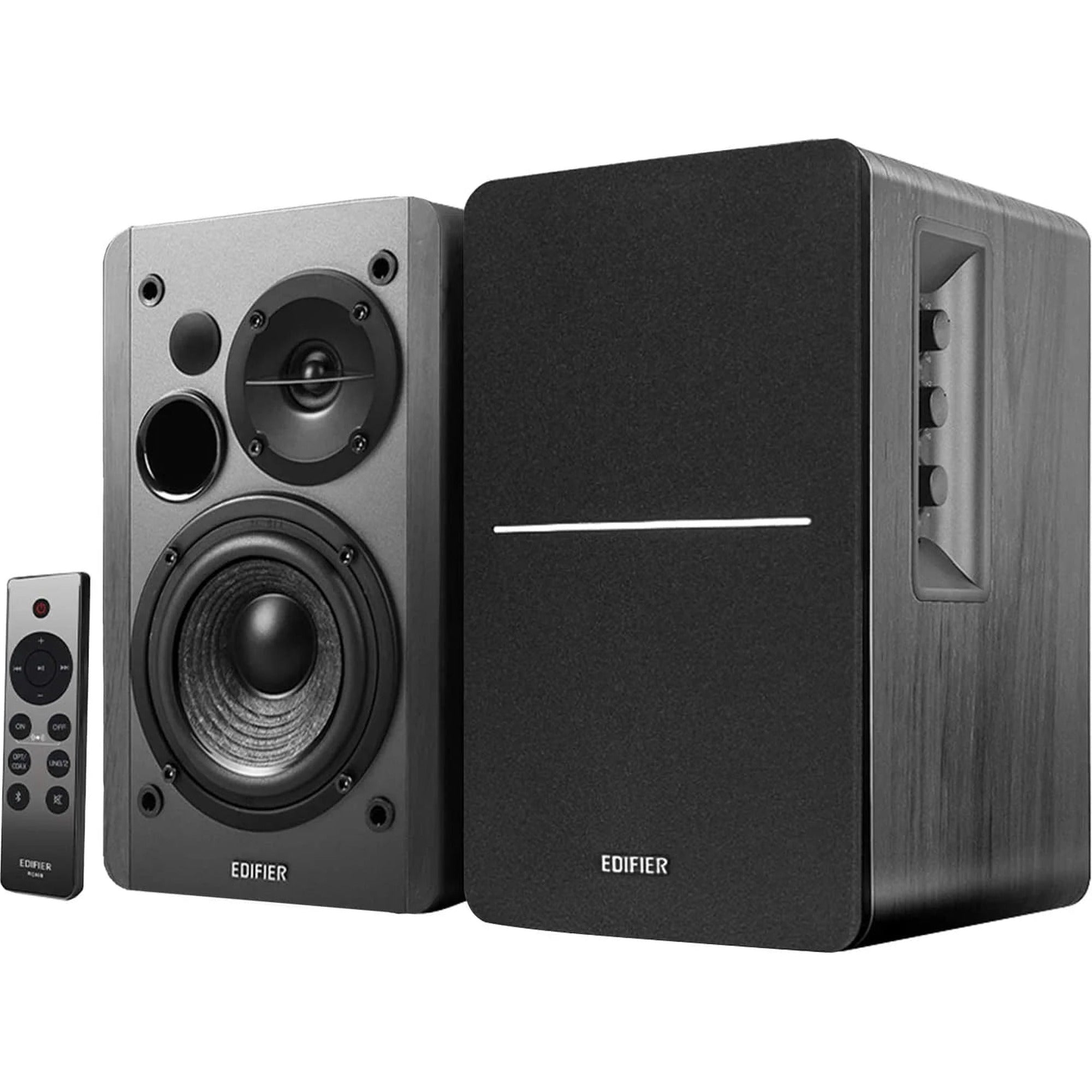 Edifier R1280DBS desktop speakers with wooden cabinets and control knobs, designed for high-quality audio on a computer desk.