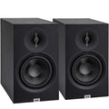 ELAC Debut B6.3 passive bookshelf speakers showing sleek black cabinets and front grilles in a home audio setup