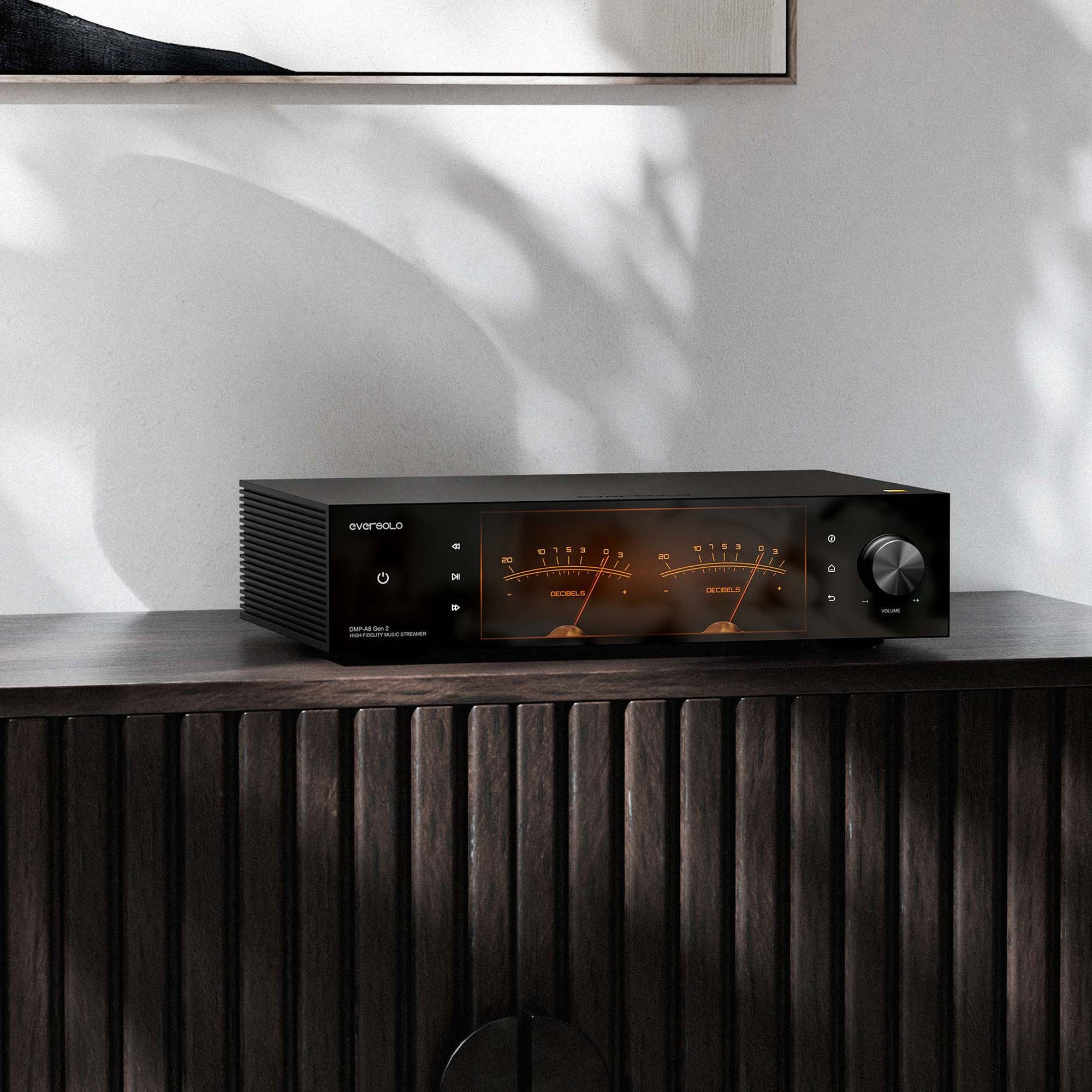 Eversolo DMP-A8 Gen 2 on a dark wood sideboard with VU meters lit