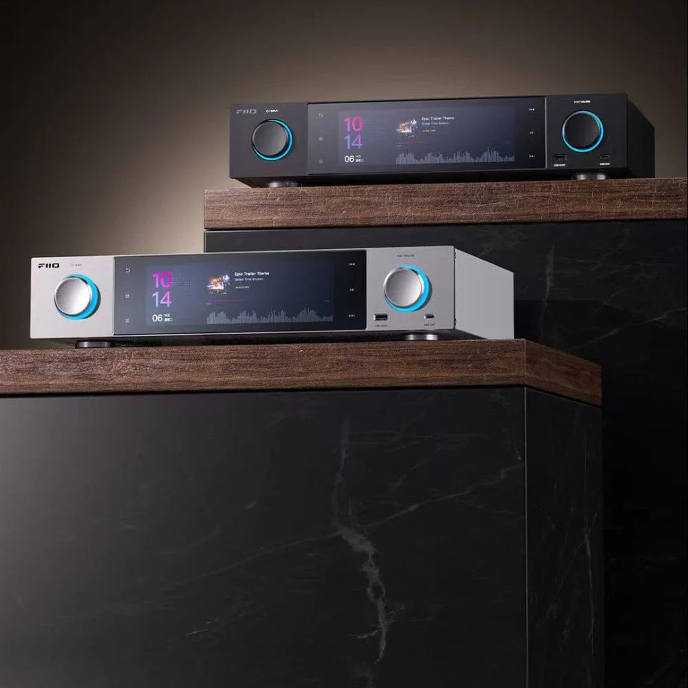 FiiO S15 music streamer with high-resolution audio output, compact black device with multiple ports on a wooden surface.