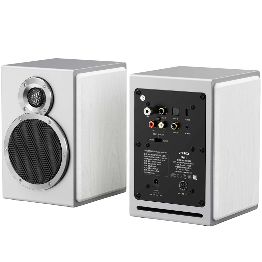 White FiiO SA1 desktop speakers with sleek design and compact size, featuring speaker grills and control knobs on the front panel.