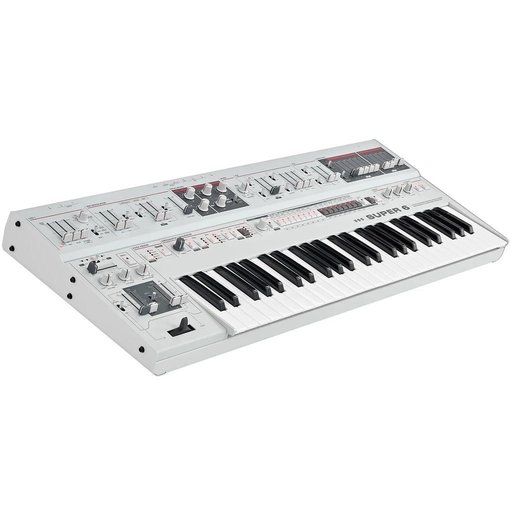 UDO Audio Super 6 synthesizer with a sleek black keyboard, featuring multiple knobs and buttons for versatile sound creation.