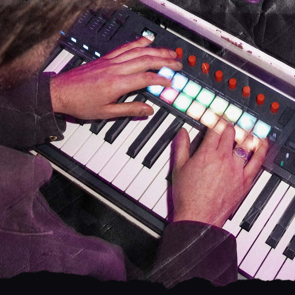 Novation FLkey 2 61 MIDI keyboard with keys and control knobs, showcased in a music studio setup.
