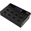 Freqport FreqTube FT1 effects pedal with controls, connected cables, and sleek black design for guitar effects and sound modulation.