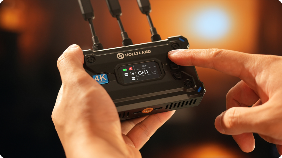 Hollyland Pyro S wireless video receiver connected to a camera, displaying a live video feed in a professional wireless video system setup.