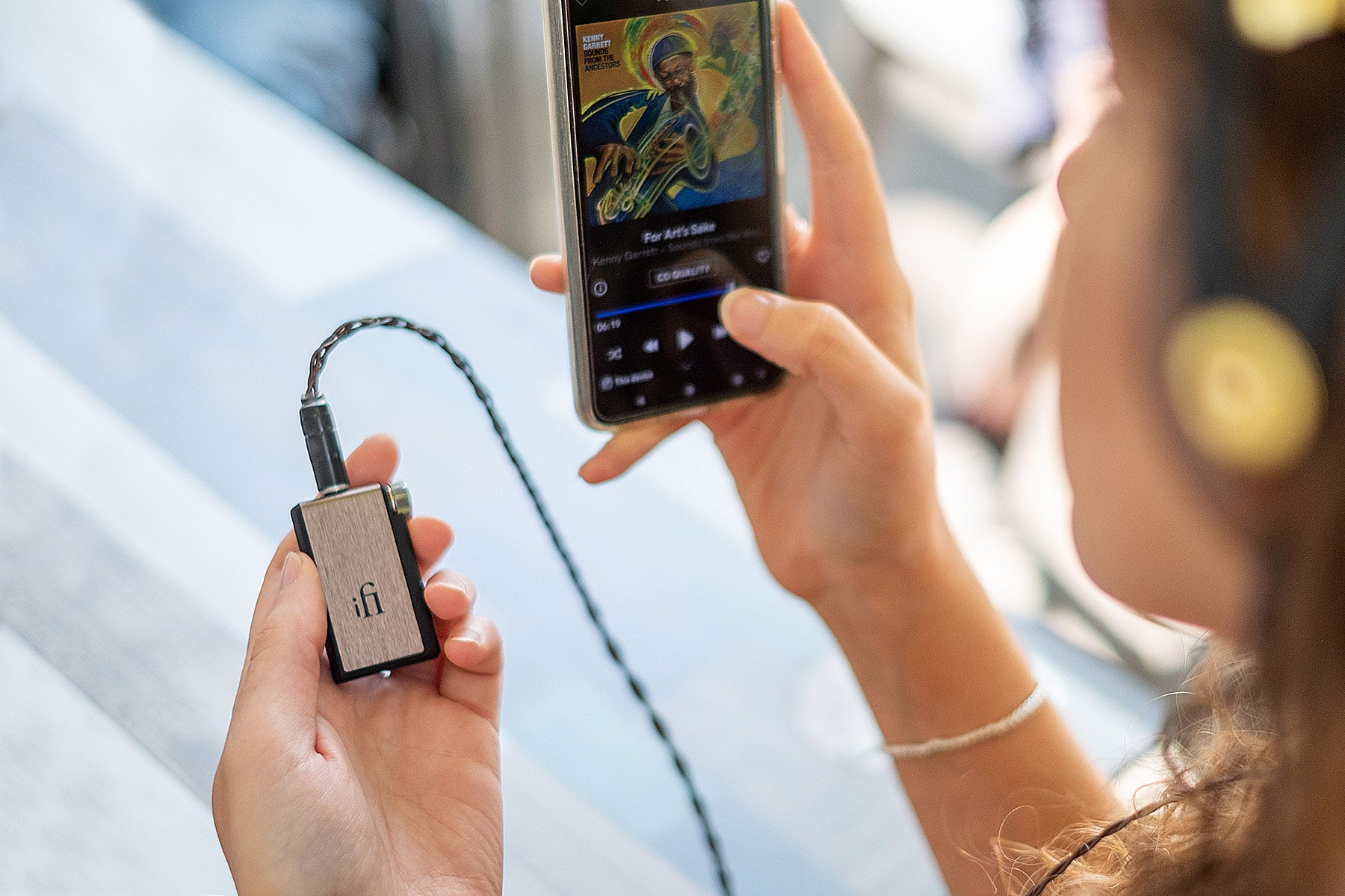 iFi Audio Go BLU headphone amplifier and DAC device with a compact design and brushed metal finish.