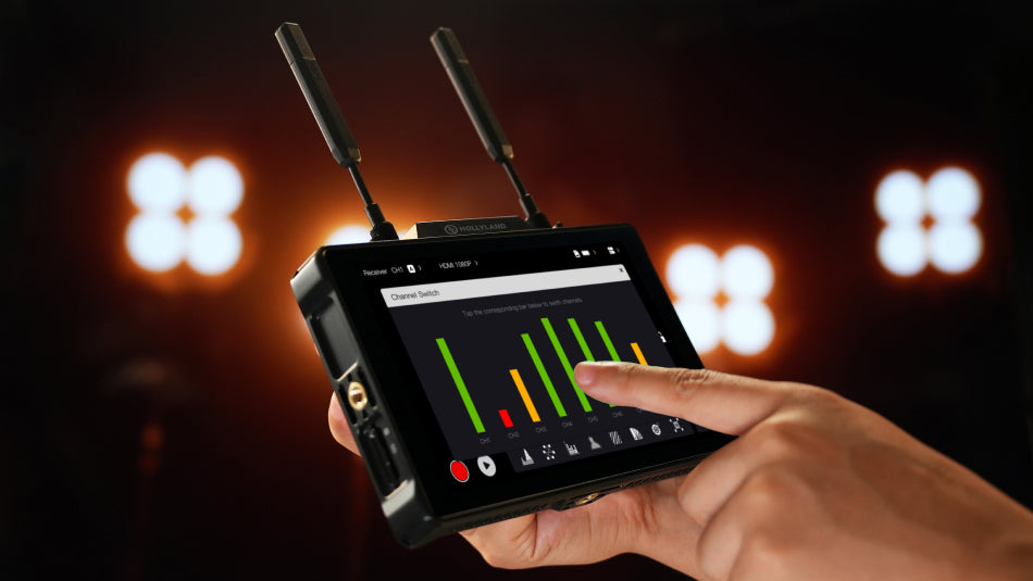 Hollyland Pyro 7 video monitor displaying multiple video feeds with interface controls and colorful display.