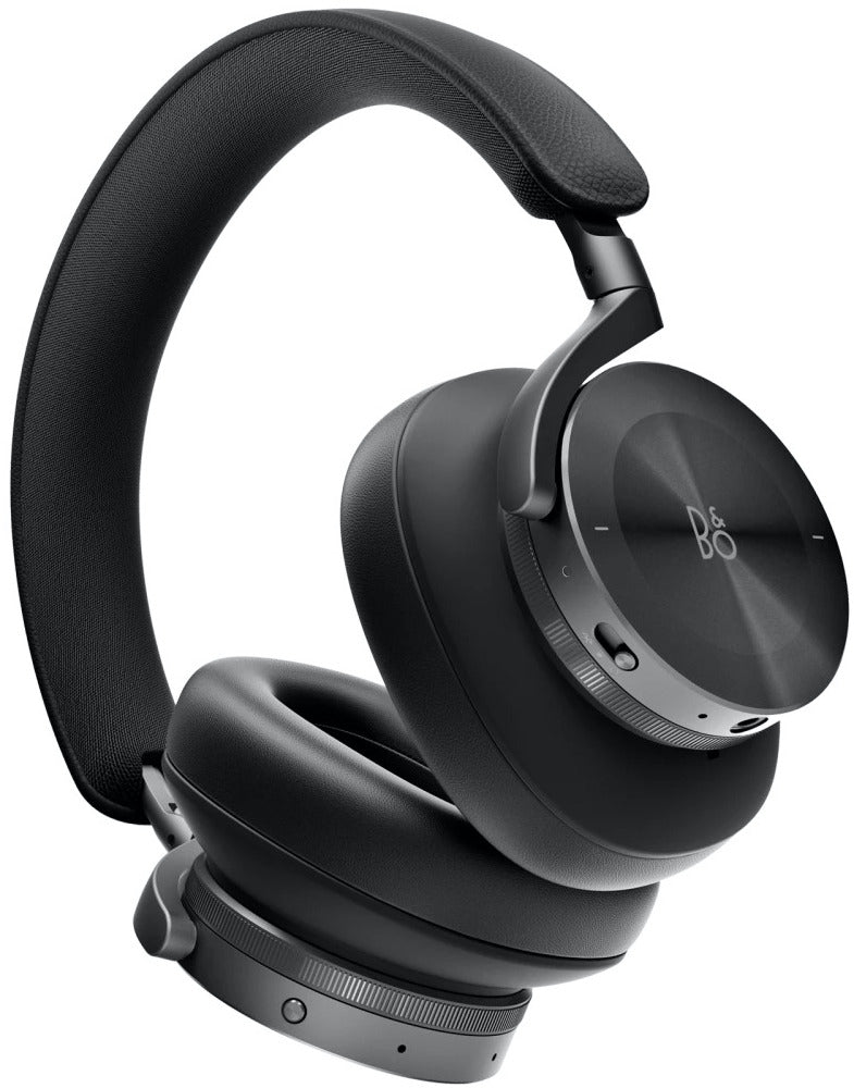 Bang & Olufsen Beoplay H95 wireless headphones with plush ear cushions and sleek black design, showing the over-ear fit and control buttons.