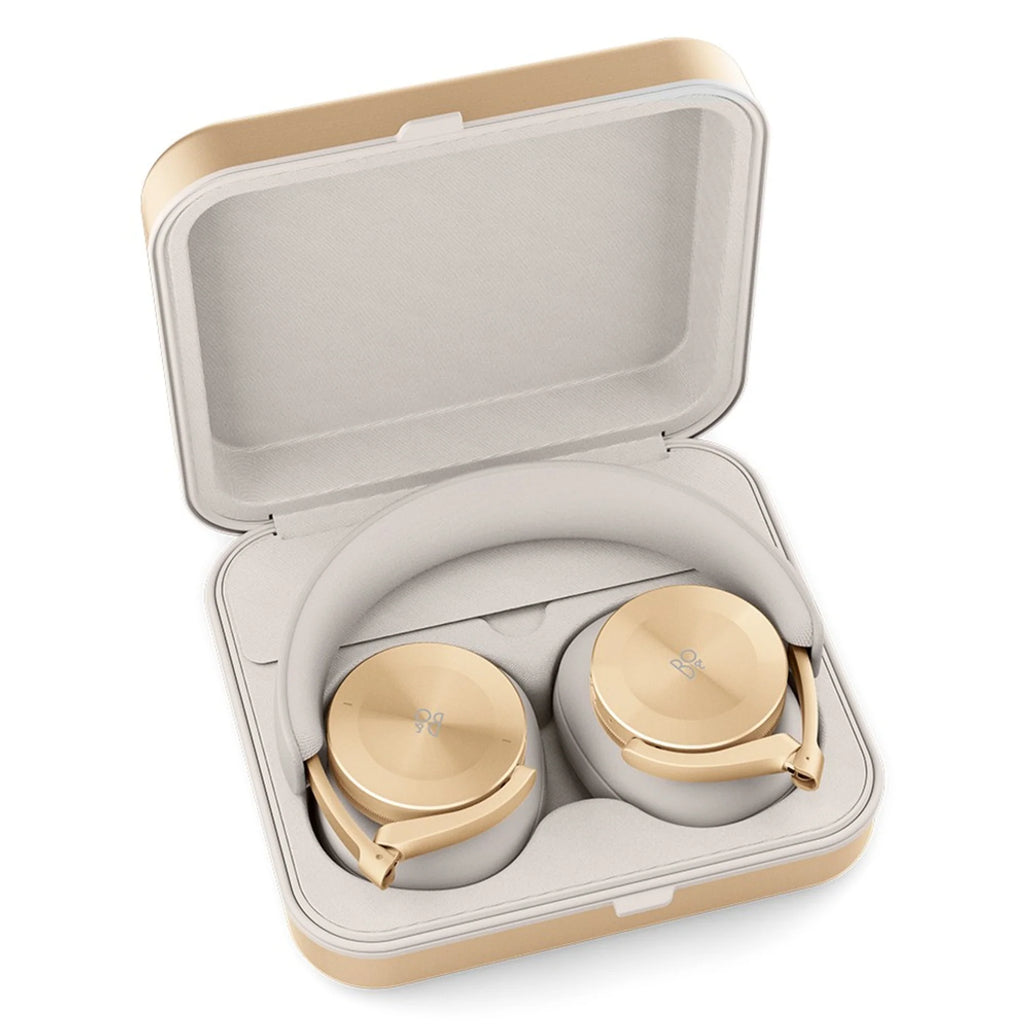 Bang & Olufsen Beoplay H95 wireless headphones in elegant gold, showing over-ear design and plush ear cushions.