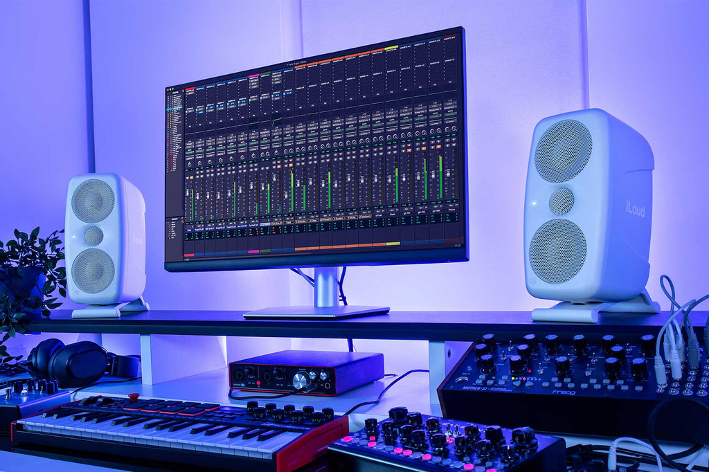 White IK Multimedia iLoud MTM MK2 active nearfield monitors with sleek design and control knobs, ideal for studio audio setup.