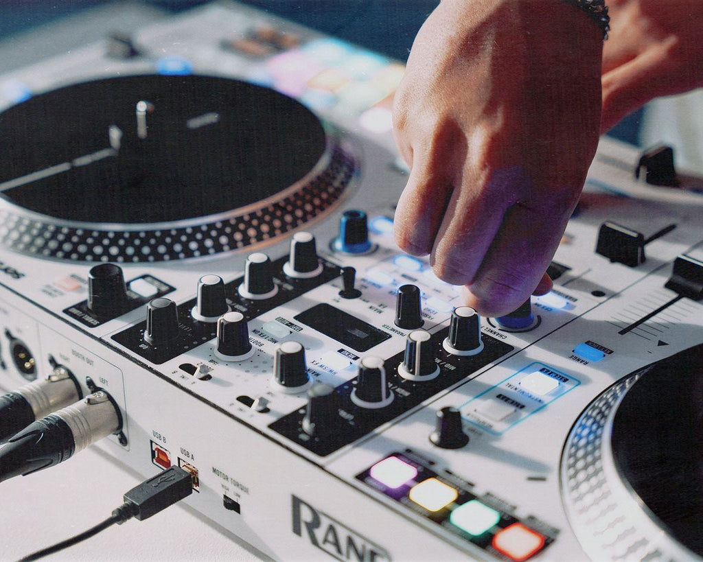 Rane One MKII DJ controller with jog wheels, mixer sections, and control knobs for professional DJ mixing and performance.